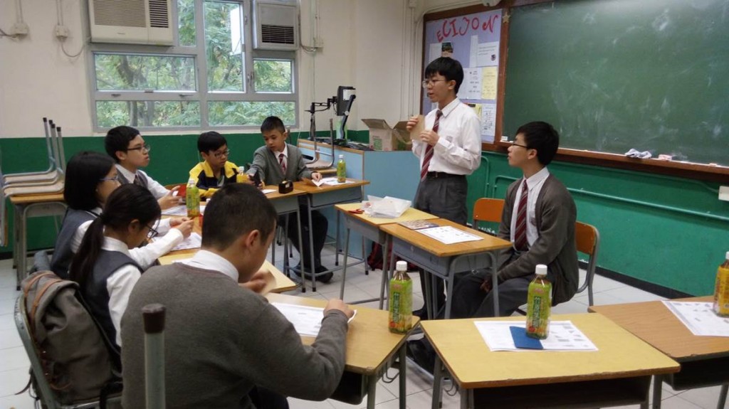 Students teaching their schoolmates about origami